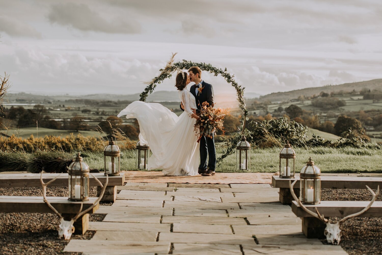 Kisses beneath an archway